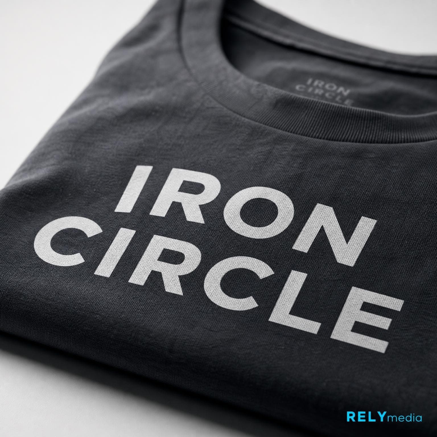 Close-up of a custom screen-printed group name on a men's shirt