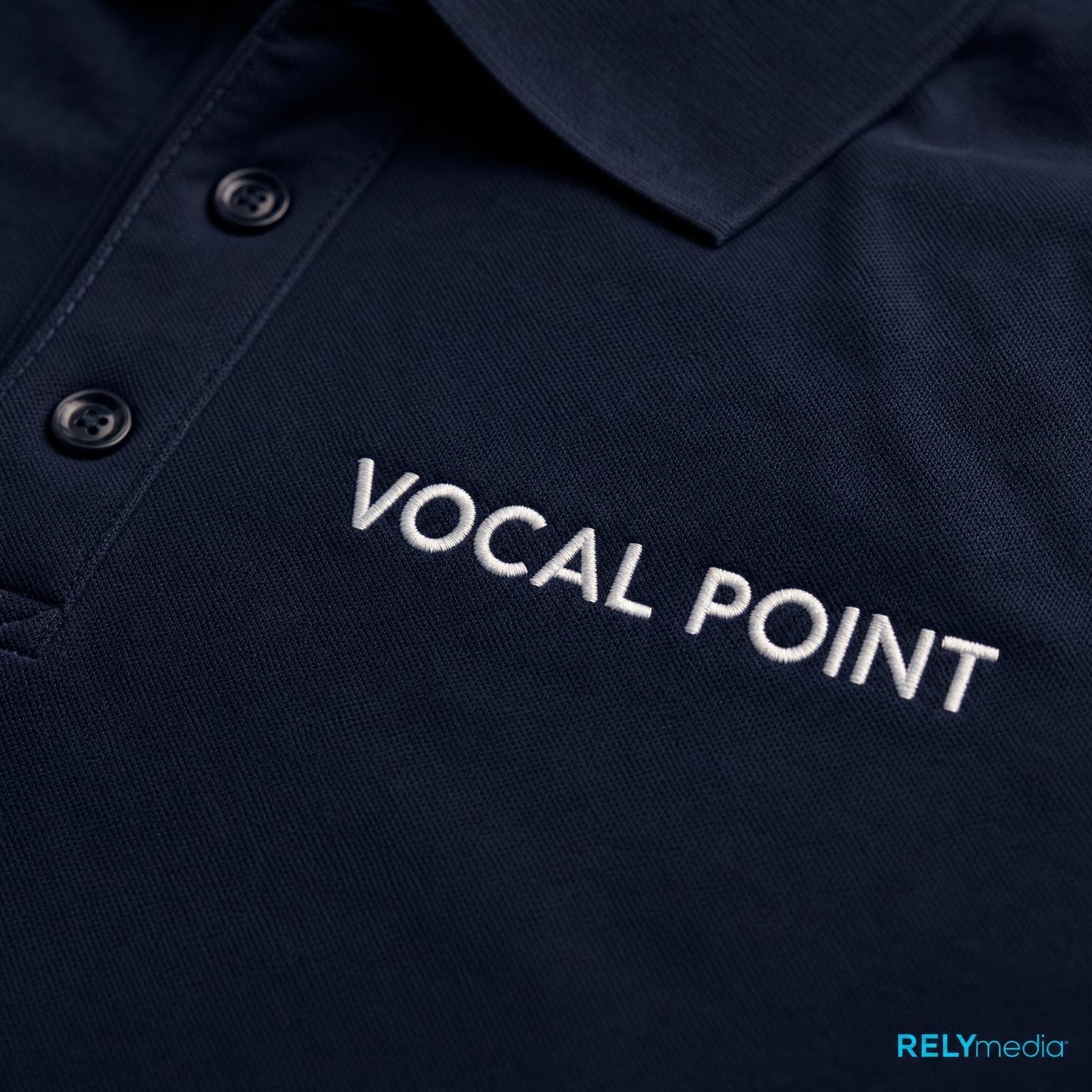 Close-up of embroidered choir logo on a performance polo