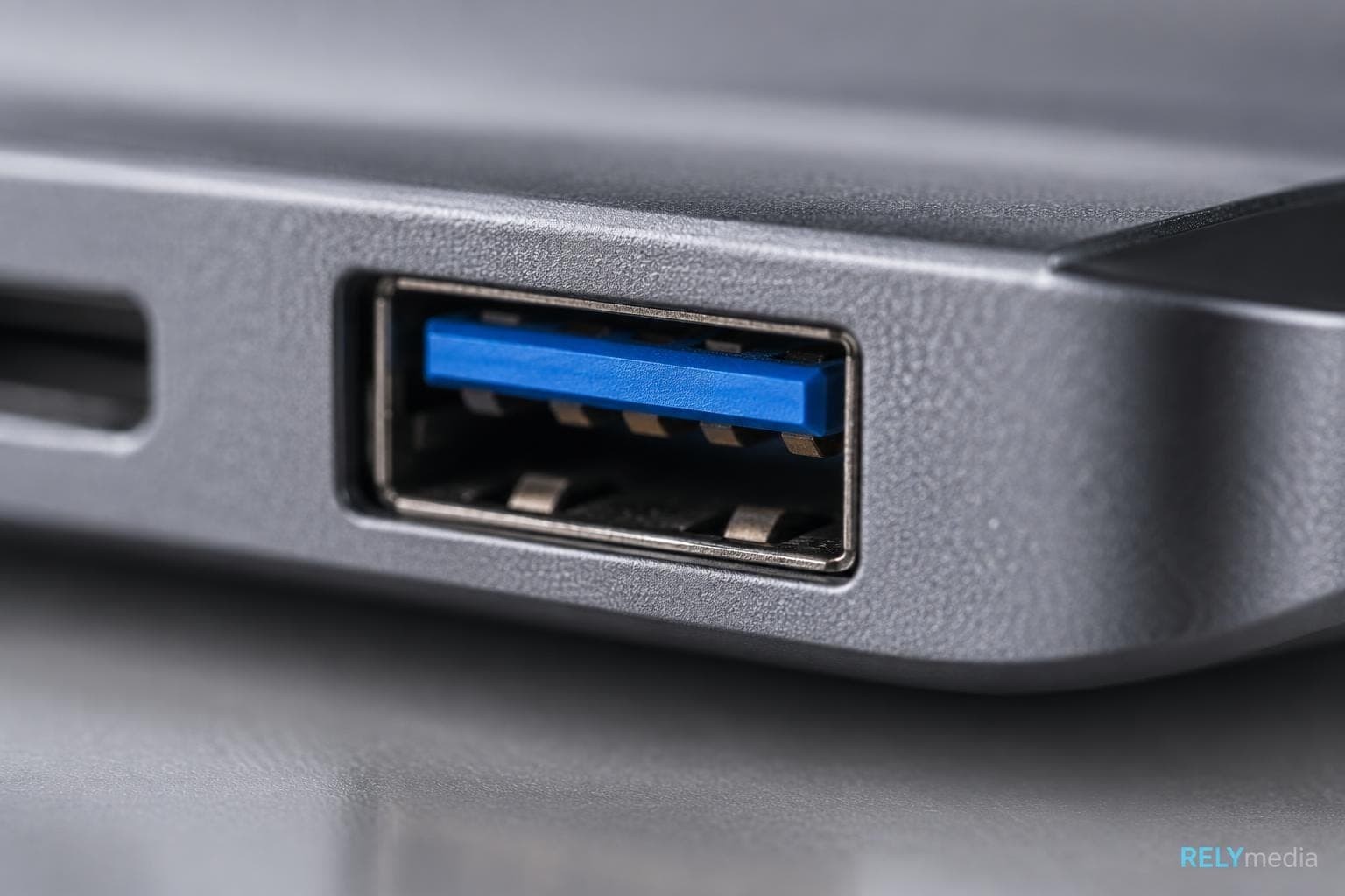 Close-up of USB ports on the side of a laptop